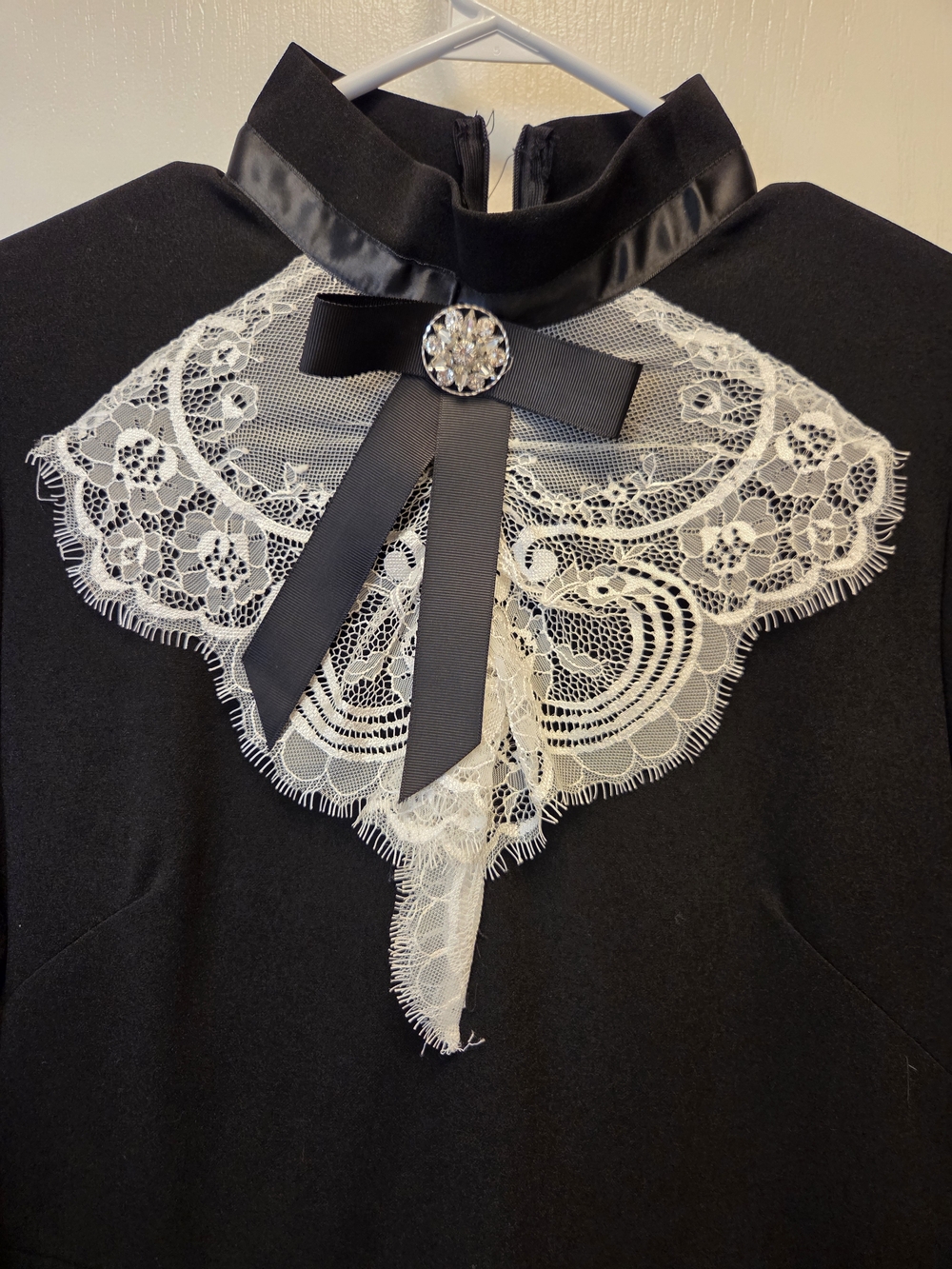 tle: Elegant Black Gothic Lolita Mini Dress with Lace Bib & Ruffle Hem